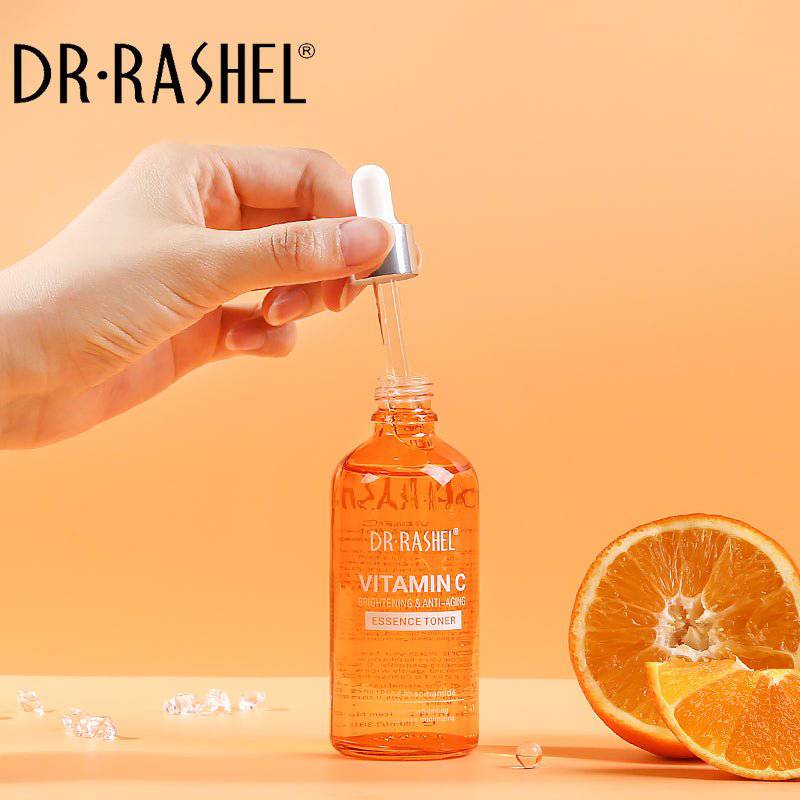 DR.RASHEL Vitamin C serum bottle with dropper and oranges on an orange background